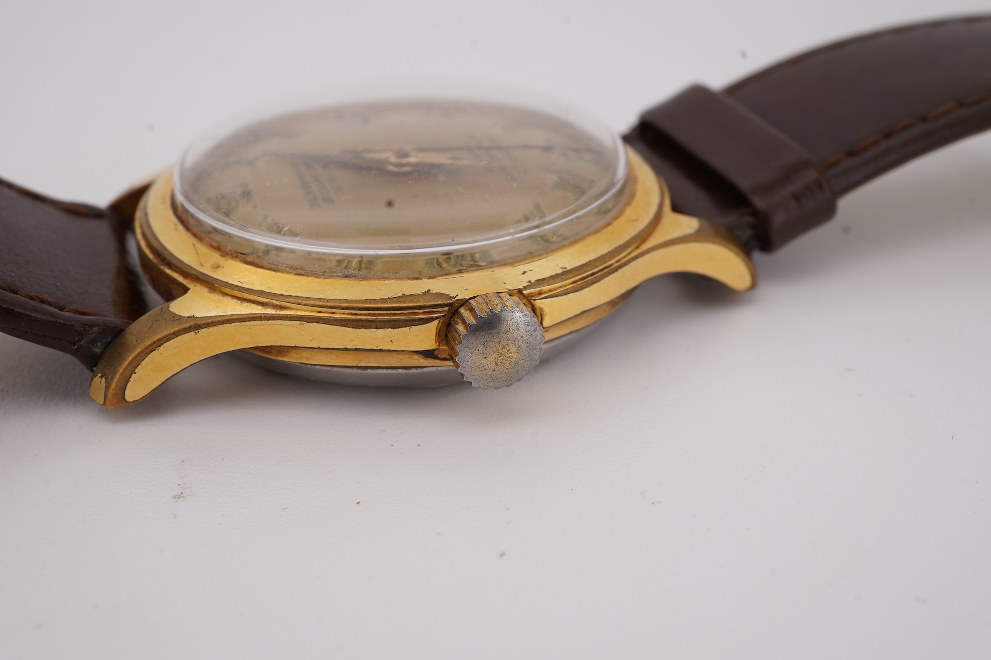 A gentleman's steel and gold plated Montfort Superautomatic wrist watch, with Roman and quarterly Arabic numerals, case diameter 34mm, on a later associated leather strap.